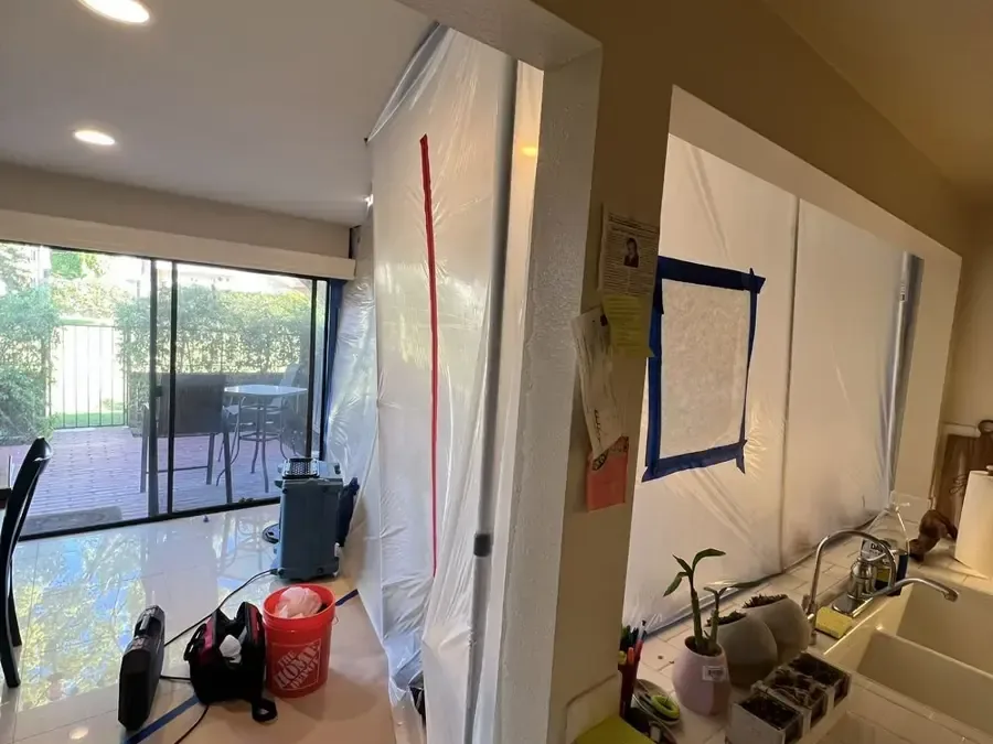 Containment plastic and drying equipment in a kitchen and dining area